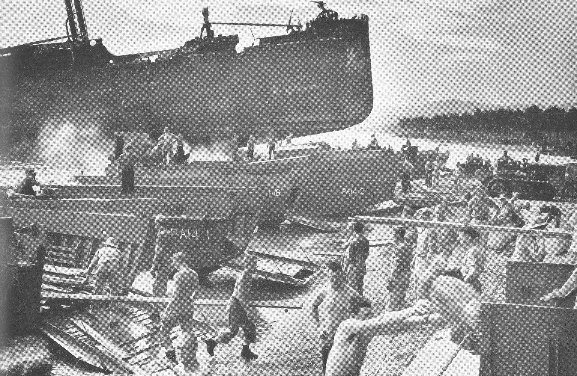 Supplies landed on the beach at Guadalcanal by landing craft. Coast Guardsmen and watercraft kept critically needed supplies flowing to the 1st Marine Division fighting in the jungles of Guadalcanal. (U.S. Navy) Supplies landed on the beach at Guadalcanal by landing craft. Coast Guardsmen and watercraft kept critically needed supplies flowing to the 1st Marine Division fighting in the jungles of Guadalcanal. (U.S. Navy)